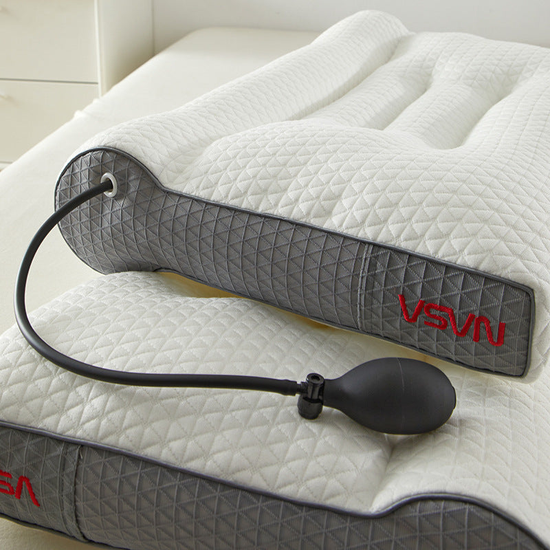 ELVic ergonomic memory foam cervical pillow resting on a bed